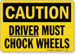 Caution Driver Must Chock Wheels Sign