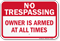 Owner Is Armed No Trespassing Sign